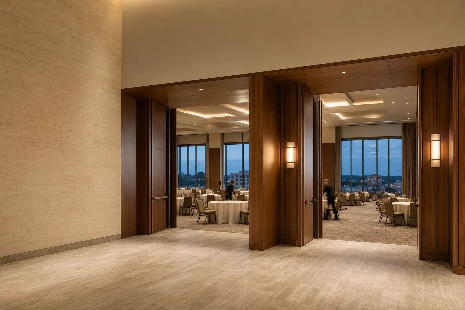A contemporary convention hotel ballroom prepared for an event.