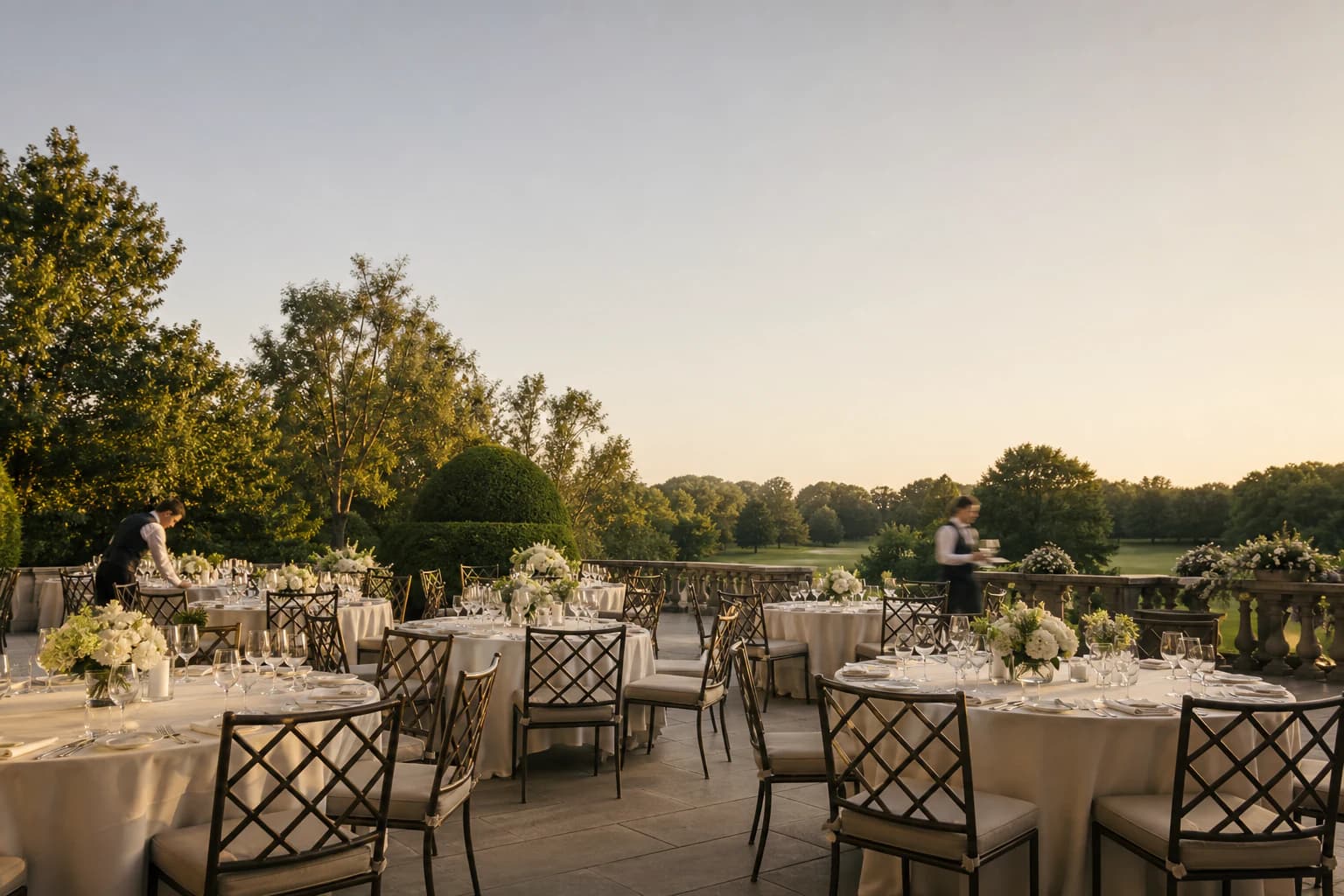 A private club terrace prepared for an event overlooking the golf course.