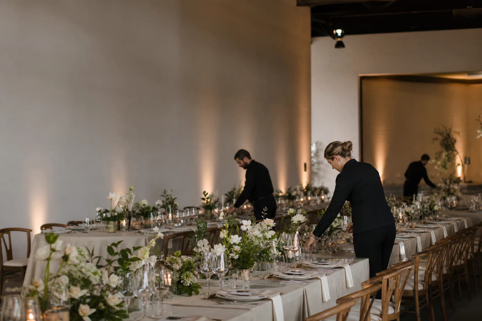 An elegant hospitality event space being prepared for service.