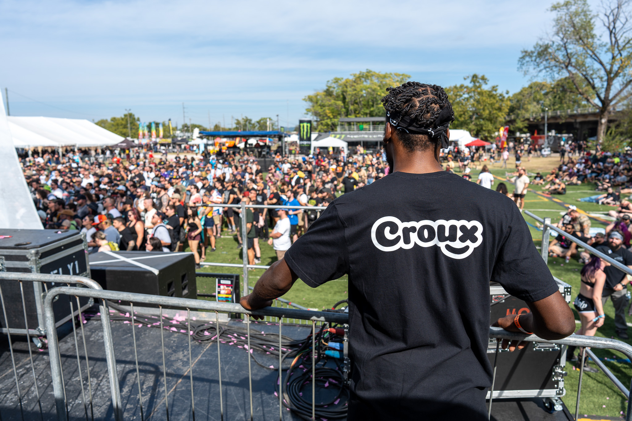 Croux worker overlooking festival crowd
